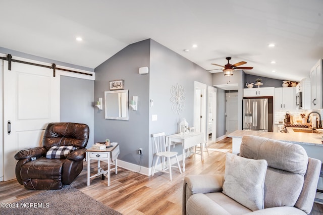 401 Kingfisher Rd, Tuckerton, NJ 08087 - living room with lofted ceiling, a barn door, a ceiling fan, light wood-style floors, and recessed lighting