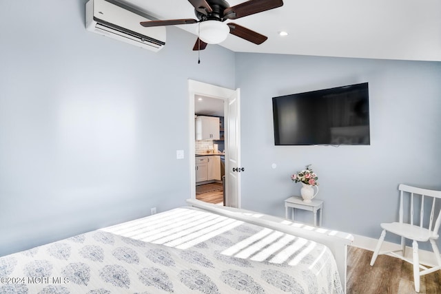 401 Kingfisher Rd, Tuckerton, NJ 08087 - bedroom featuring a wall unit AC, wood finished floors, vaulted ceiling, recessed lighting, and ceiling fan