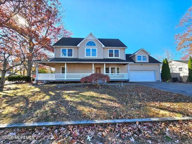 19 Sunrise Blvd, Forked River, NJ 08731 - view of front of house with a porch and asphalt driveway