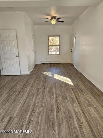 19 Sunrise Blvd, Forked River, NJ 08731 - empty room featuring wood finished floors, crown molding, ceiling fan, and a baseboard heating unit