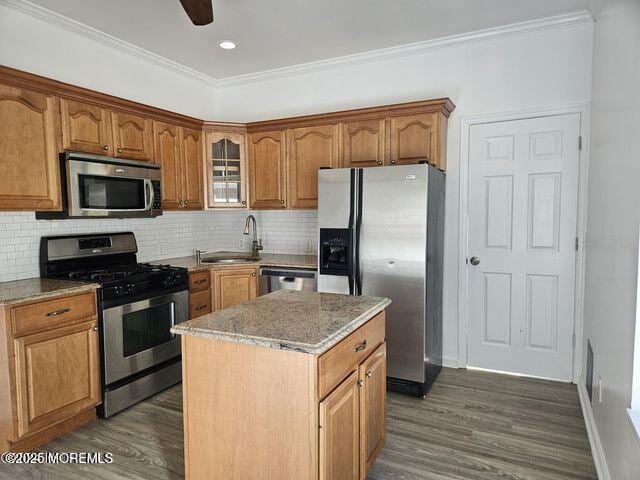 19 Sunrise Blvd, Forked River, NJ 08731 - kitchen with appliances with stainless steel finishes, dark wood-type flooring, a kitchen island, light stone countertops, and decorative backsplash
