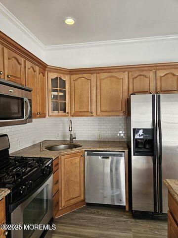 19 Sunrise Blvd, Forked River, NJ 08731 - kitchen with stainless steel appliances, dark wood-style flooring, decorative backsplash, glass insert cabinets, and ornamental molding
