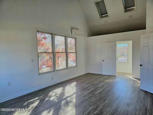 19 Sunrise Blvd, Forked River, NJ 08731 - empty room featuring high vaulted ceiling, wood finished floors, and a wall mounted AC