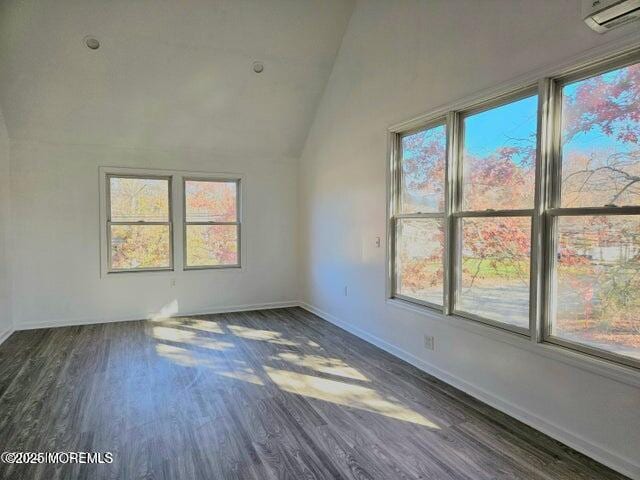 19 Sunrise Blvd, Forked River, NJ 08731 - empty room with wood finished floors, a wall unit AC, and lofted ceiling