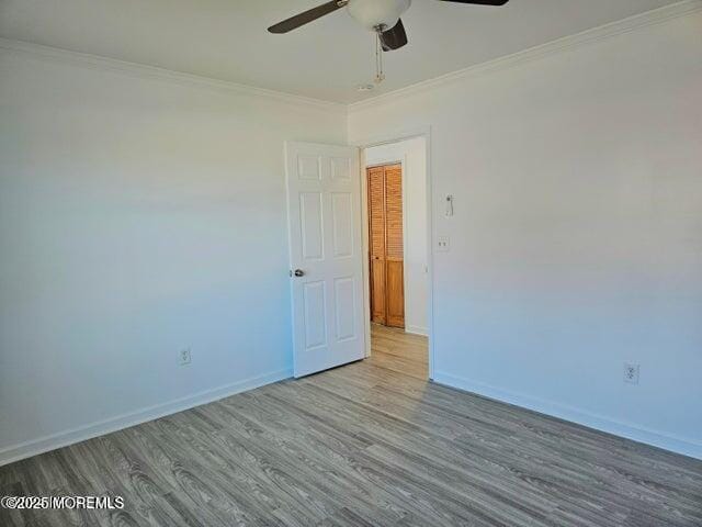 19 Sunrise Blvd, Forked River, NJ 08731 - spare room with ceiling fan, wood finished floors, and crown molding