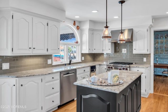 1510 Bel Aire Ct E, Point Pleasant, NJ 08742 - kitchen featuring appliances with stainless steel finishes, exhaust hood, white cabinetry, light stone counters, and recessed lighting