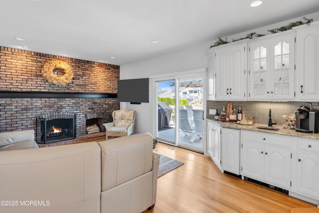 1510 Bel Aire Ct E, Point Pleasant, NJ 08742 - living area featuring a fireplace, light wood-style flooring, and recessed lighting