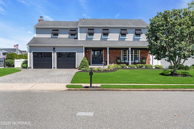 1510 Bel Aire Ct E, Point Pleasant, NJ 08742 - view of front of home with a chimney, covered porch, an attached garage, decorative driveway, and a shingled roof