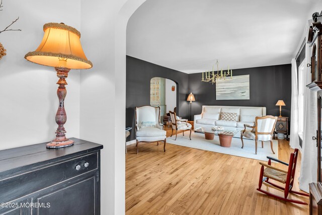 1510 Bel Aire Ct E, Point Pleasant, NJ 08742 - living room featuring arched walkways and wood finished floors