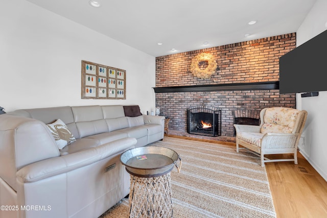 1510 Bel Aire Ct E, Point Pleasant, NJ 08742 - living area with wood finished floors, a fireplace, and recessed lighting