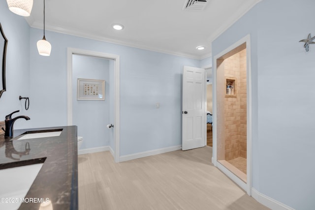 1510 Bel Aire Ct E, Point Pleasant, NJ 08742 - full bathroom with ornamental molding, wood finished floors, a tile shower, double vanity, and recessed lighting