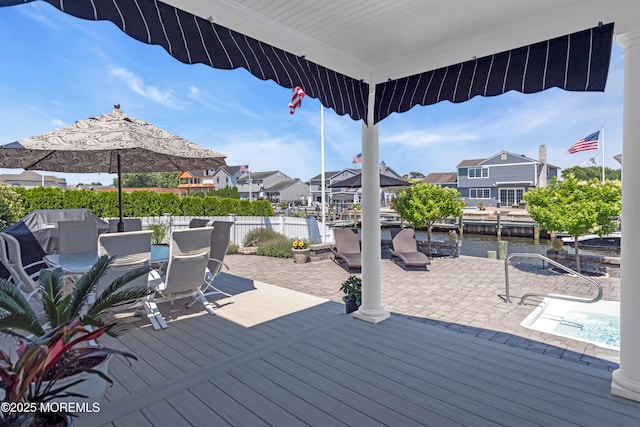 1510 Bel Aire Ct E, Point Pleasant, NJ 08742 - wooden terrace featuring a residential view, outdoor dining area, a patio, a water view, and a jacuzzi