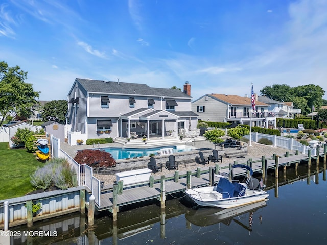 1510 Bel Aire Ct E, Point Pleasant, NJ 08742 - dock area with a fenced backyard, a water view, and a patio area
