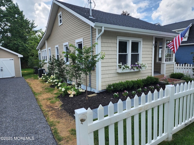 97 Asbury Ave, Atlantic Highlands, NJ 07716 - view of front of house with an outdoor structure and roof with shingles