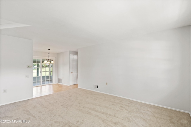 10 Haven Dr Unit B, Matawan, NJ 07747 - empty room with a chandelier and light colored carpet