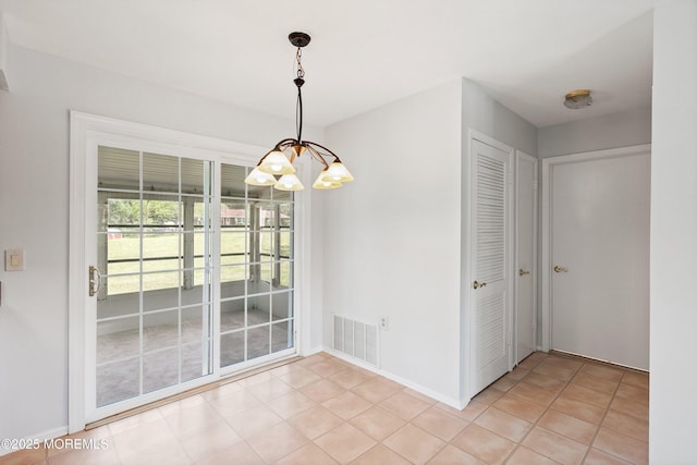 10 Haven Dr Unit B, Matawan, NJ 07747 - unfurnished dining area featuring a chandelier and light tile patterned floors