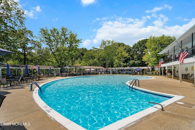 10 Haven Dr Unit B, Matawan, NJ 07747 - community pool featuring a patio and view of wooded area