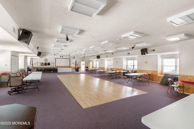 10 Haven Dr Unit B, Matawan, NJ 07747 - miscellaneous room featuring a textured ceiling, a wainscoted wall, carpet, and wooden walls