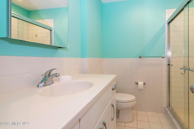 68 Linden Ct, Spring Lake Heights, NJ 07762 - bathroom with a shower stall, tile patterned floors, vanity, tile walls, and a wainscoted wall