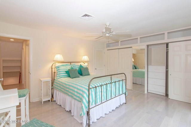 68 Linden Ct, Spring Lake Heights, NJ 07762 - bedroom featuring multiple closets, light wood finished floors, and ceiling fan