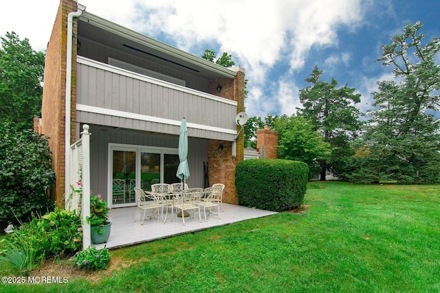 68 Linden Ct, Spring Lake Heights, NJ 07762 - back of property with a yard, outdoor dining area, and a wooden deck