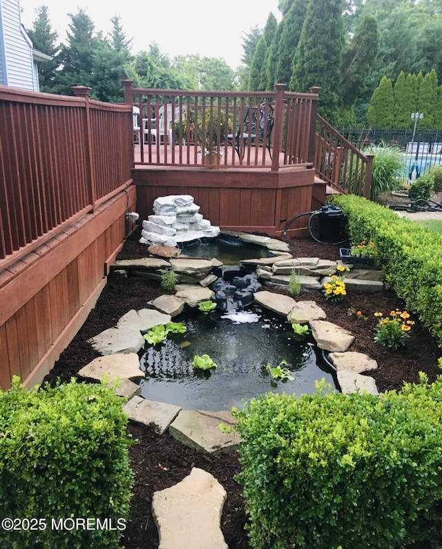 70 Desai Ct, Freehold, NJ 07728 - view of yard with a garden pond, stairs, and a deck