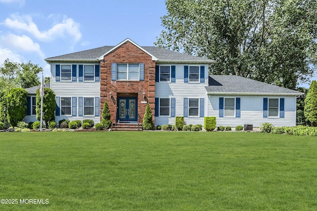 70 Desai Ct, Freehold, NJ 07728 - view of front of home featuring french doors, a front yard, and roof with shingles