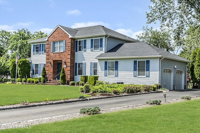 70 Desai Ct, Freehold, NJ 07728 - view of front of house featuring asphalt driveway, a garage, a front yard, and roof with shingles