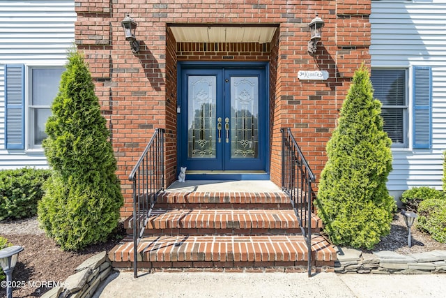 70 Desai Ct, Freehold, NJ 07728 - doorway to property featuring french doors and brick siding