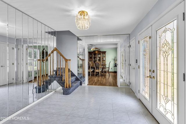 70 Desai Ct, Freehold, NJ 07728 - entryway with a chandelier, stairs, and french doors