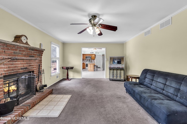 70 Desai Ct, Freehold, NJ 07728 - living area with a ceiling fan, carpet floors, crown molding, and a fireplace