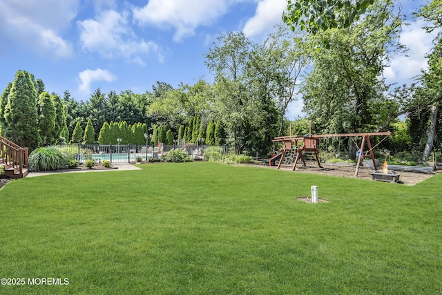 70 Desai Ct, Freehold, NJ 07728 - view of community featuring a playground and a swimming pool