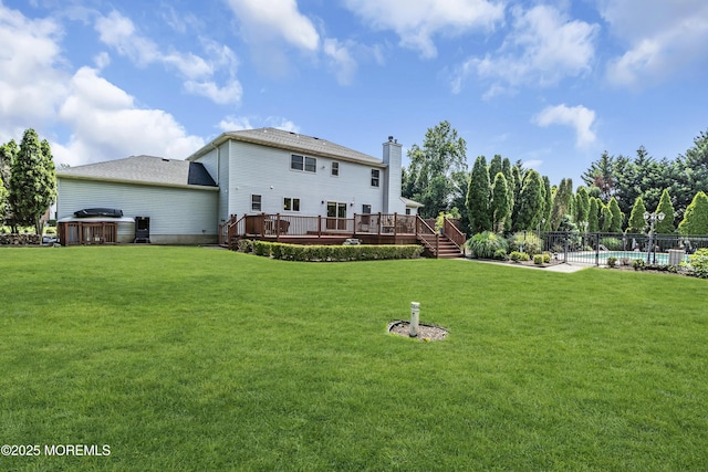 70 Desai Ct, Freehold, NJ 07728 - rear view of house with a deck and a chimney