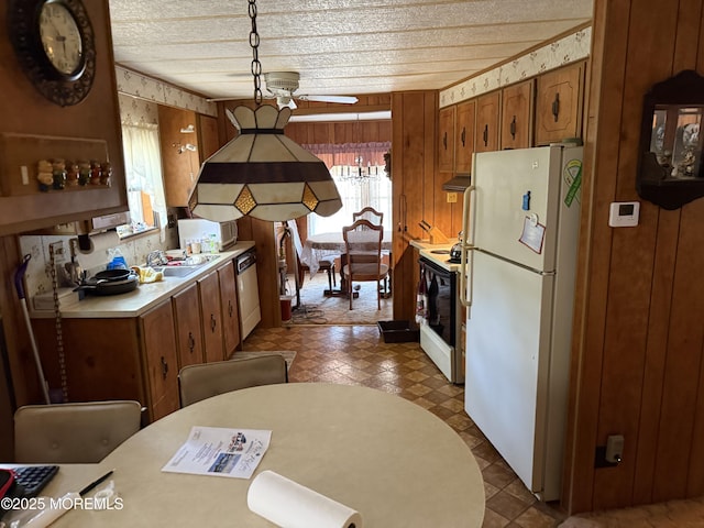 42 Eagle Dr, Whiting, NJ 08759 - kitchen with freestanding refrigerator, electric range oven, light countertops, dishwashing machine, and brown cabinets