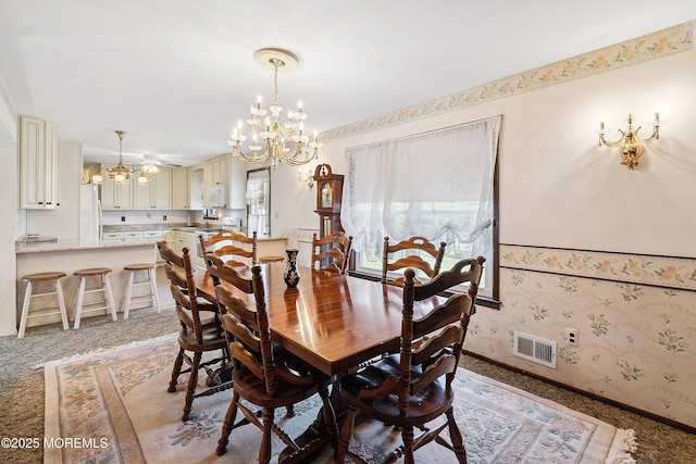 620 Pacific Ave, Beachwood, NJ 08722 - dining space with a chandelier, light colored carpet, and wallpapered walls
