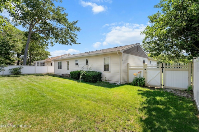 620 Pacific Ave, Beachwood, NJ 08722 - rear view of house featuring a fenced backyard and a gate