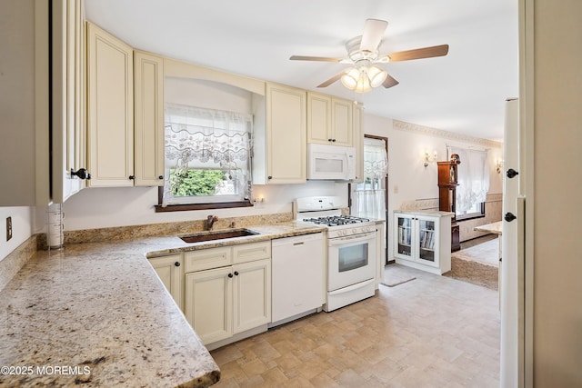620 Pacific Ave, Beachwood, NJ 08722 - kitchen featuring cream cabinetry, white appliances, ceiling fan, and light stone countertops