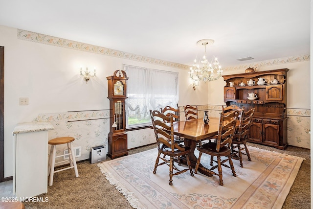 620 Pacific Ave, Beachwood, NJ 08722 - dining space featuring light colored carpet, a chandelier, wainscoting, and wallpapered walls