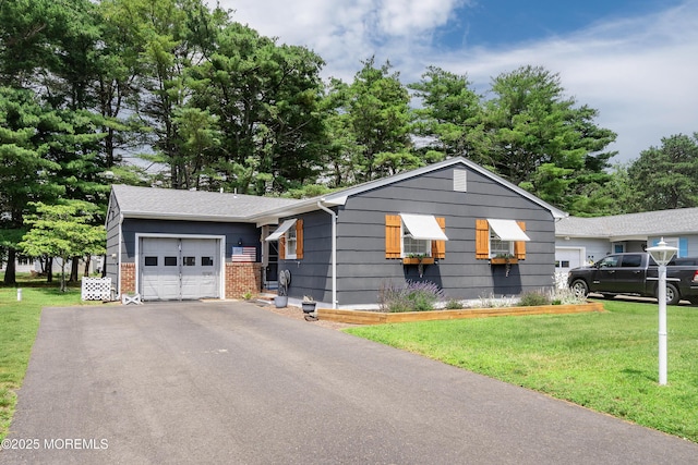 1086 Edgebrook Dr S, Toms River, NJ 08757 - view of front facade featuring a garage, a front yard, brick siding, and driveway