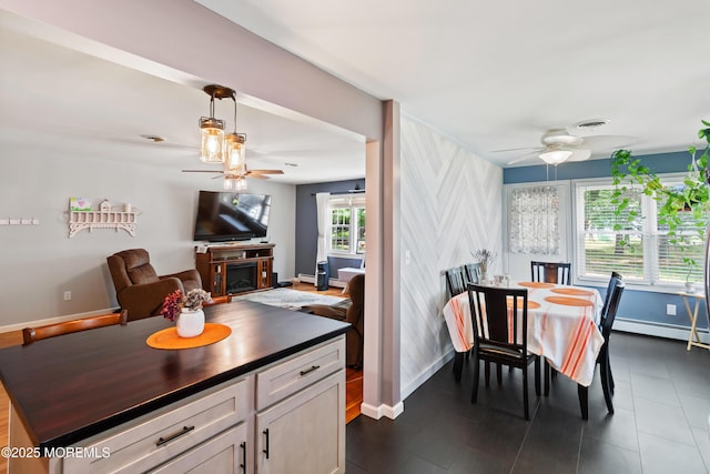 1086 Edgebrook Dr S, Toms River, NJ 08757 - kitchen featuring a ceiling fan, a baseboard heating unit, hanging light fixtures, and white cabinets