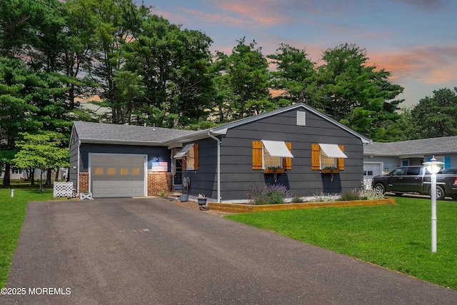 1086 Edgebrook Dr S, Toms River, NJ 08757 - view of front facade with an attached garage, a front lawn, driveway, and brick siding