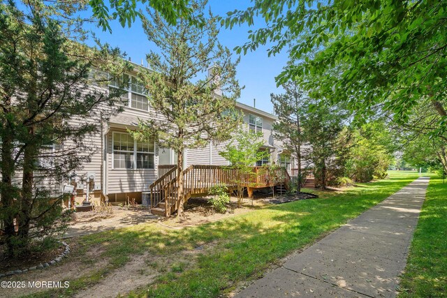 13 Jill Ct, Franklin Twp, NJ 08873 - view of side of home featuring a wooden deck and a lawn