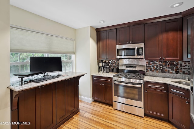 13 Jill Ct, Franklin Twp, NJ 08873 - kitchen featuring stainless steel appliances, light wood-style flooring, tasteful backsplash, light stone countertops, and recessed lighting
