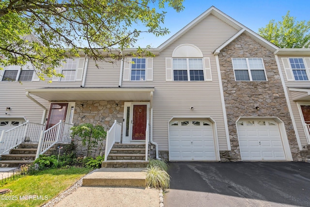 13 Jill Ct, Franklin Twp, NJ 08873 - view of property featuring stone siding, driveway, and an attached garage