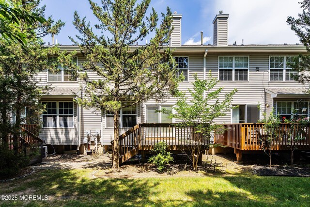 13 Jill Ct, Franklin Twp, NJ 08873 - rear view of house with a deck, a chimney, stairs, and a lawn
