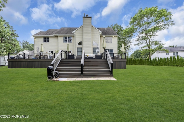 10 Biscayne Ct, Jackson, NJ 08527 - back of property with a chimney, a wooden deck, a yard, and stairway