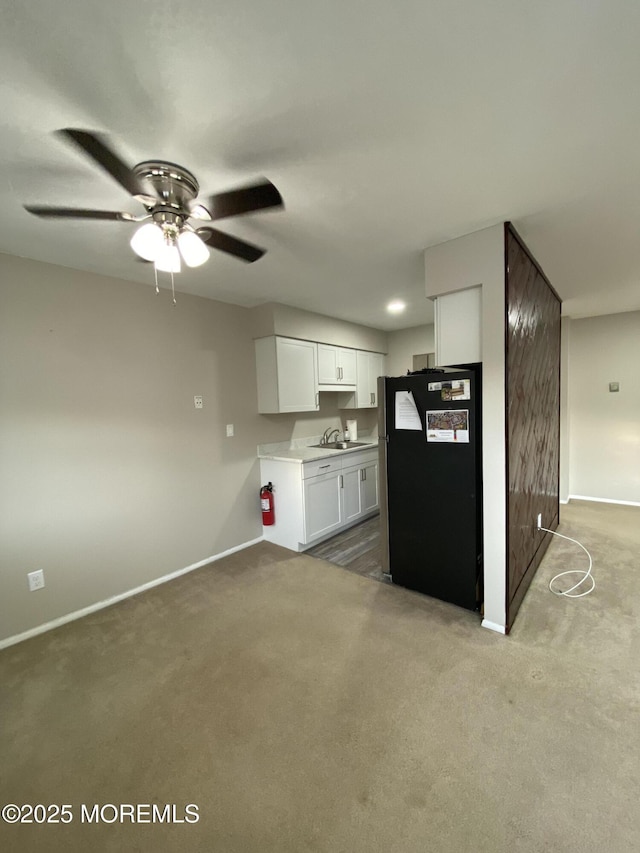 10 E Windsor Ter, Freehold, NJ 07728 - kitchen featuring freestanding refrigerator, carpet floors, white cabinets, light countertops, and ceiling fan