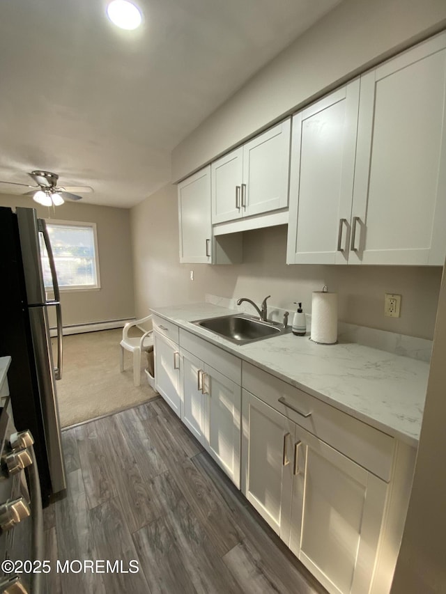 10 E Windsor Ter, Freehold, NJ 07728 - kitchen with ceiling fan, dark wood-type flooring, white cabinetry, stove, and freestanding refrigerator