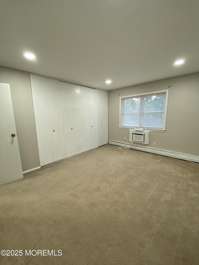 10 E Windsor Ter, Freehold, NJ 07728 - unfurnished bedroom with carpet, recessed lighting, a wall mounted AC, and a baseboard radiator