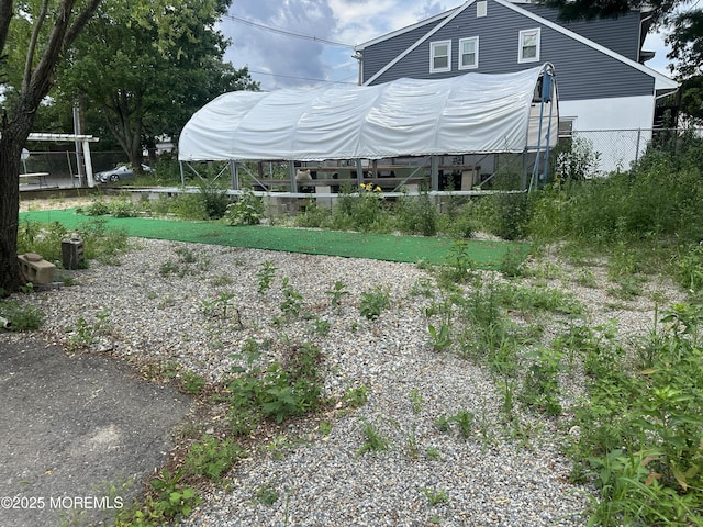 570 Mantoloking Rd, Brick, NJ 08723 - rear view of property with a greenhouse